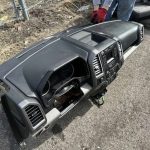 2015 Ford F150  Complete dash panel with instrument cluster, dash airbag, climate controls, and radio.