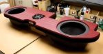 a custom car audio system package that includes: - Amp - Sub box - 2 JL Audio 13.5 TW5’s - Plug and play harness for a HK system - 4 gauge OFC and RCAs - JL Audio 1000/1D - Driver’s side back wall plate - Image 5