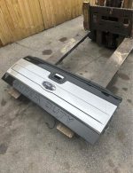 99-16 stamped superduty platinum tailgate with the camera and step. - Image 2