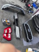 2021-2023 Ford F150 Left headlamp Left and Right tail lamp Complete grill with shutters Front bumper assembly w/fog lamps and harness Rear bumper with sensors and tow hitch