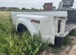 2020 F350 platinum color is pearl white has a ding in the passenger Dooley flare. And the driver bed rail is dented from a fifth wheel. - Image 4