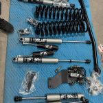 Ford F250/F450 4 Inch Fox Lift Kit  Carli coils, Carli track bar 4 fox reservoir, bds/ fox dual steering stabilizer.