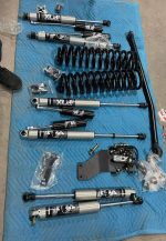 Ford F250/F450 4 Inch Fox Lift Kit  Carli coils, Carli track bar 4 fox reservoir, bds/ fox dual steering stabilizer.