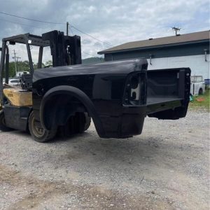 2009–2018 Dodge Ram 1500 5’7” short bed in black. OEM factory bed in good condition,