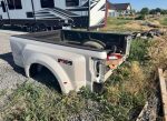 2020 F350 platinum color is pearl white has a ding in the passenger Dooley flare. And the driver bed rail is dented from a fifth wheel. - Image 5