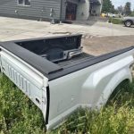 2020 F350 platinum color is pearl white has a ding in the passenger Dooley flare. And the driver bed rail is dented from a fifth wheel.